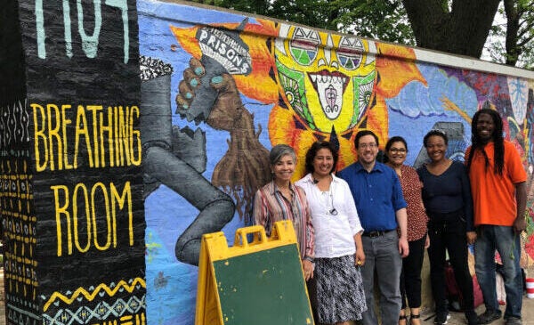 a group of CCTS community experts gather outside a south side community meeting space