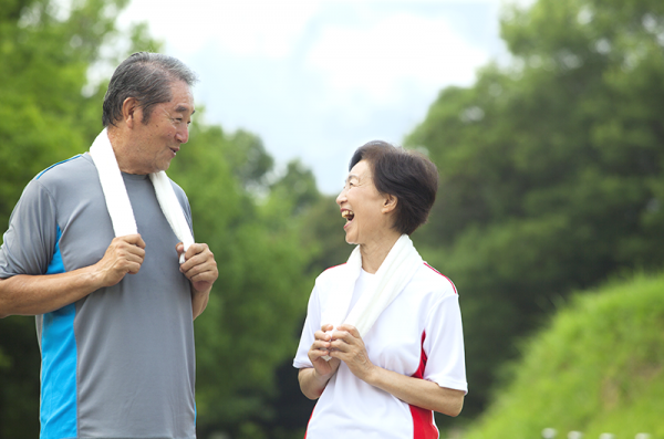 older asian couple exercising