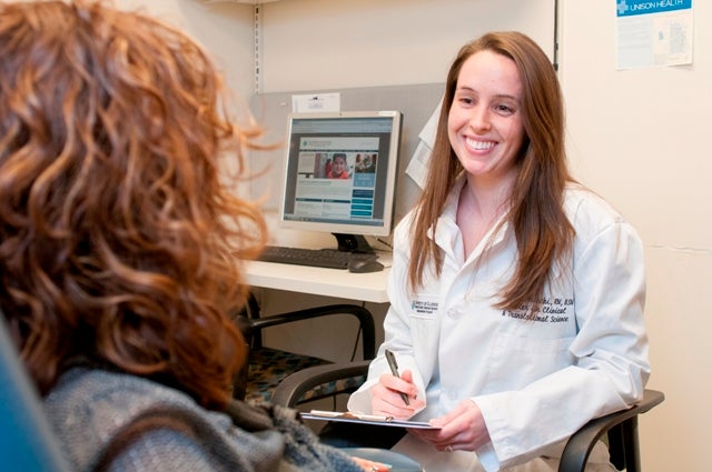 A study coordinator goes through the informed consent process with a potential volunteer