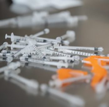a pile of medical syringes. photo courtesy of Joshua Clark, UIC. 