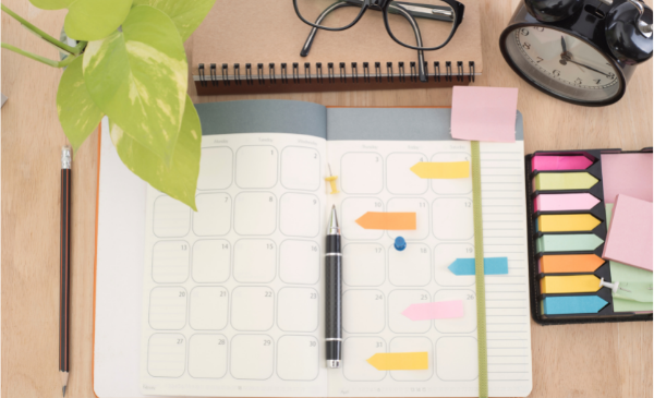 calendar with pen and sticky notes
