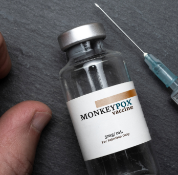 a vial of the monkeypox vaccine and syringe 