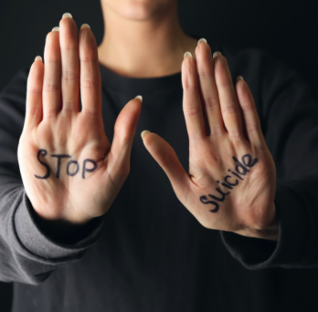 hands with the words stop suicide 