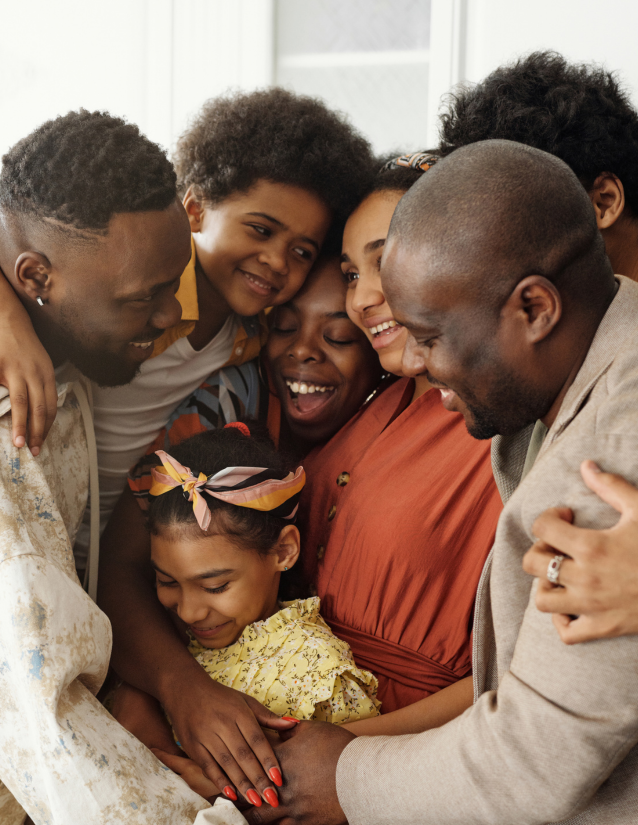 African American family hugging and smiling