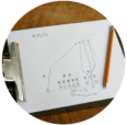 clipboard with pencil drawing of a team play strategy