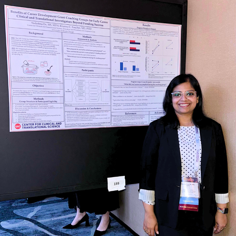 Sudeshna De stands in front of her poster at TS 2025
